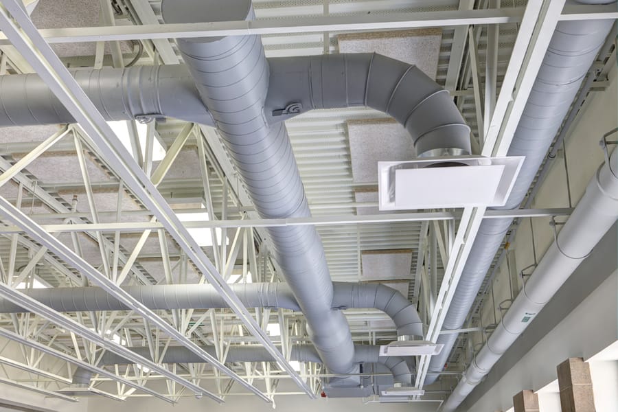 Exposed air ducts in commercial building.