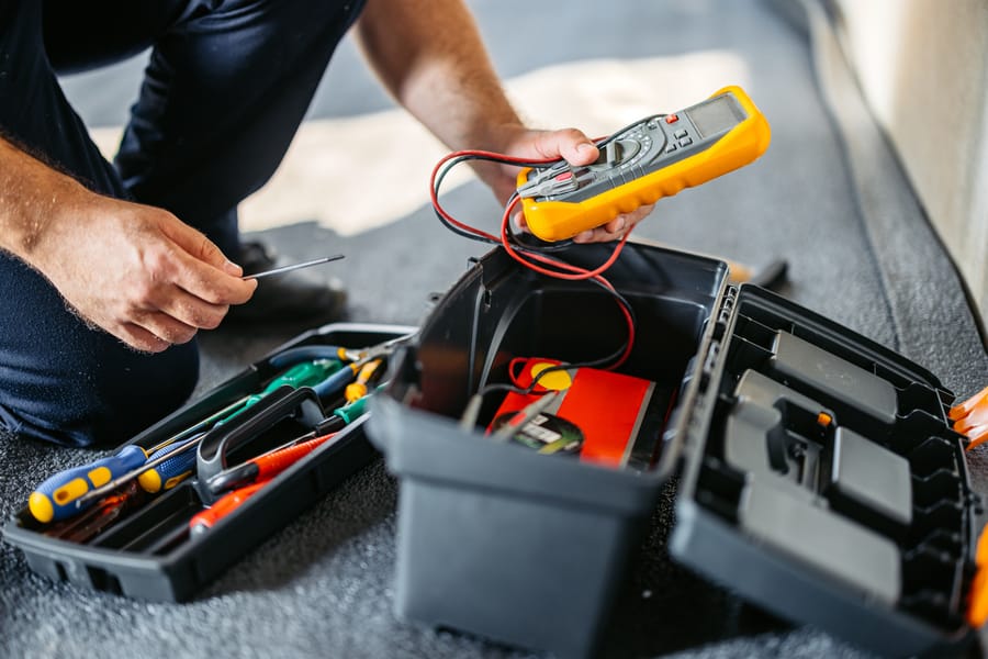 Electrician preparing tools for an electrical code inspection