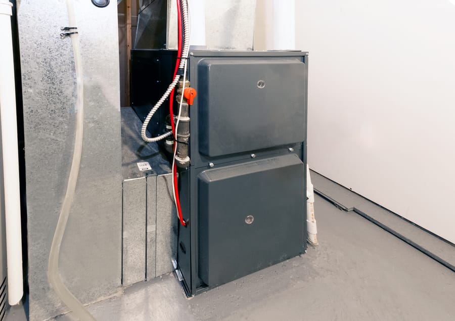 A home high energy efficient furnace in a basement.