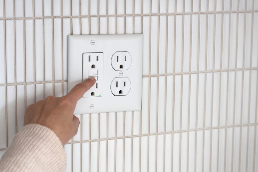 Outlets being tested during a sure protection installation appointment.