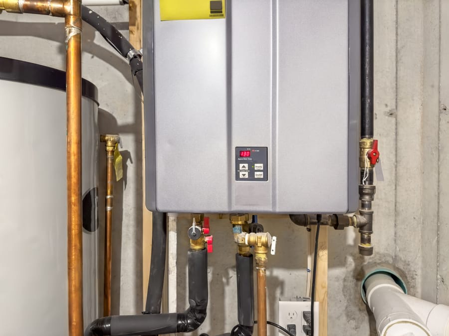 Tankless water heater in basement.