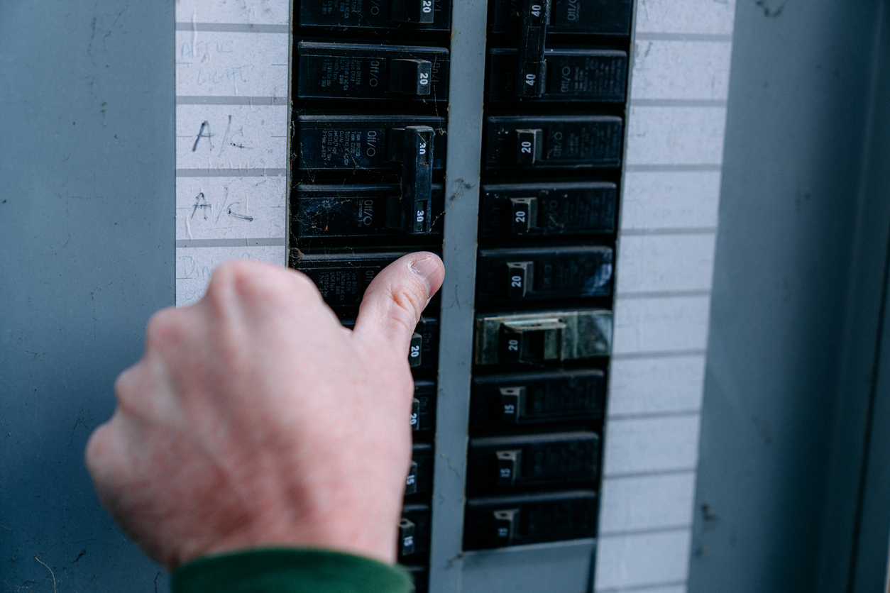 Electrician testing an electrical panel